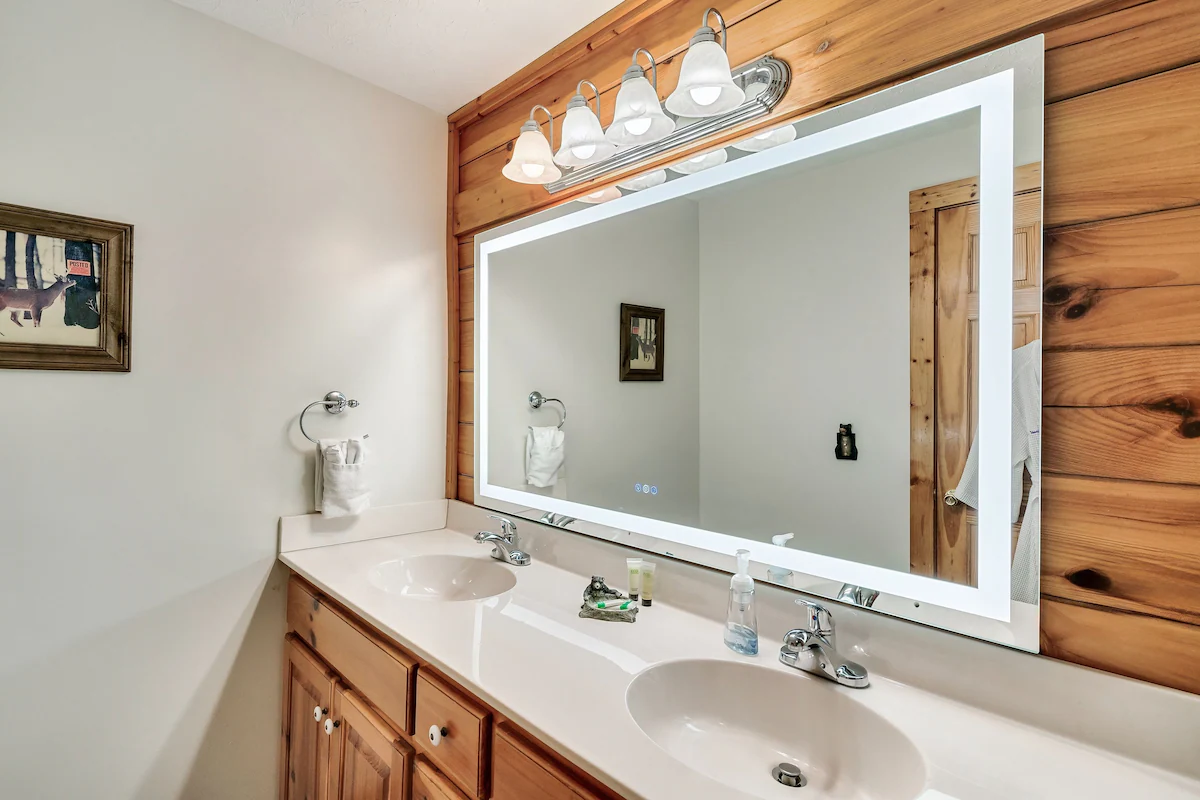 Bedroom with knotty pine walls and deck access