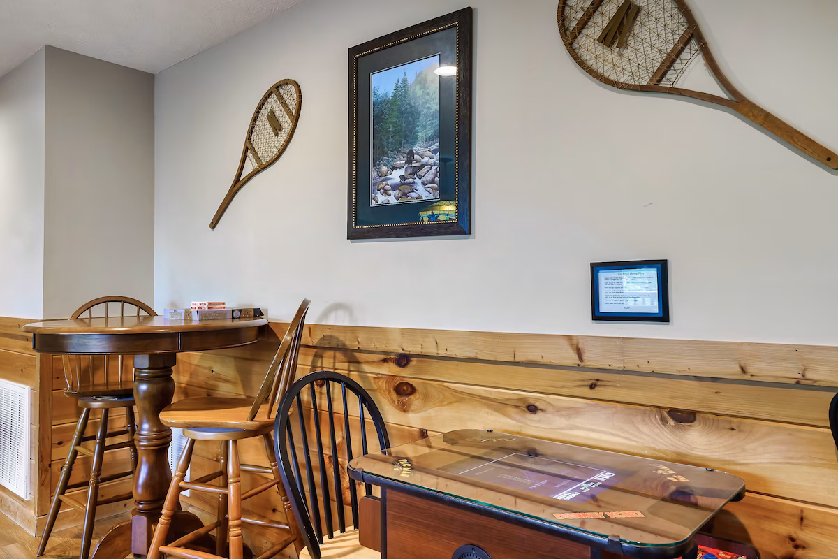 Game room with stone fireplace